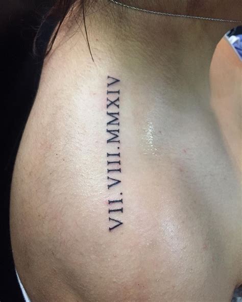 A beautiful full size back piece, this tattoo ensures. . Shoulder roman numeral tattoo